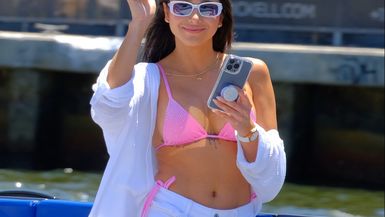 Capturing Serenity: Beauty with a Camera on a Tranquil Boat Ride! 🚤📸💖